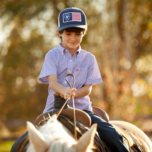 child riding horse